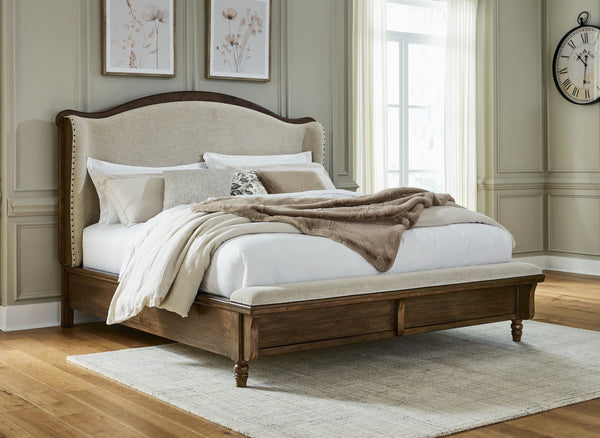 Sturlayne Brown Queen Upholstered Panel Bed front view with upholstered headboard