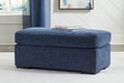 Evansley Navy Nuvella Ottoman angled view