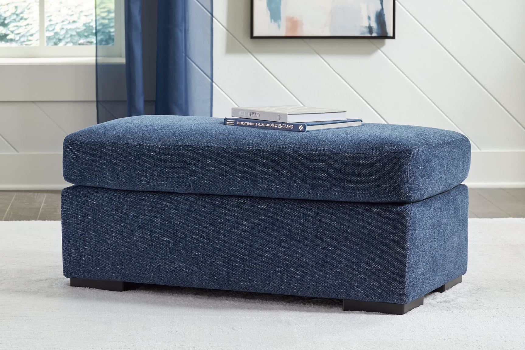 Evansley Navy Nuvella Ottoman angled view