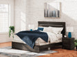 Hollivern Dark Gray King Panel Bed - angled side view