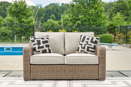 Beachcroft Beige Outdoor Loveseat front view with cushions
