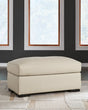 Treasure Trove Almond Leather Match Ottoman angled side view