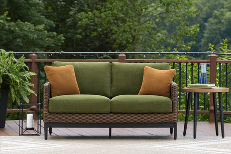 Horizon Hall brown and green outdoor loveseat front angle