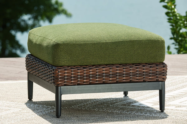 Horizon Hall outdoor ottoman front view with green cushion