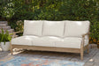 Carter Hall beige outdoor sofa angled side view