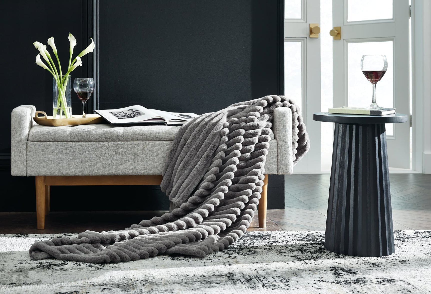 Alsonwell Gray Faux Fur Throw folded on sofa