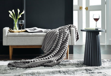 Alsonwell Gray Faux Fur Throw folded on sofa