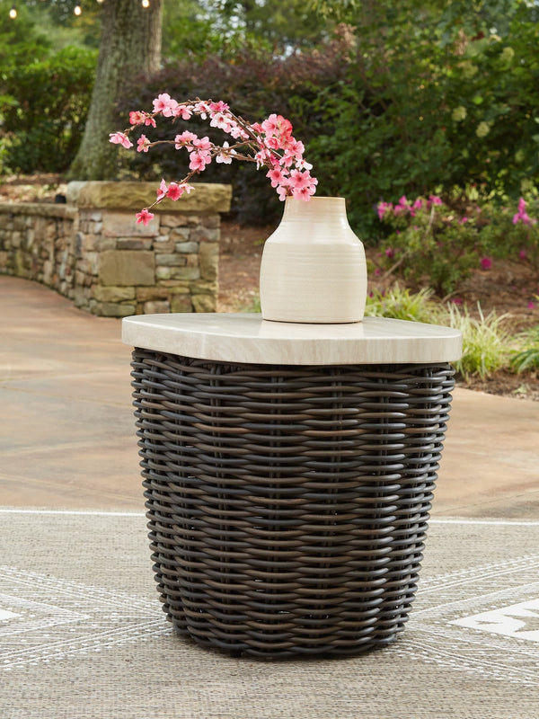 Kimora outdoor end table with beige and dark brown wicker, angled view