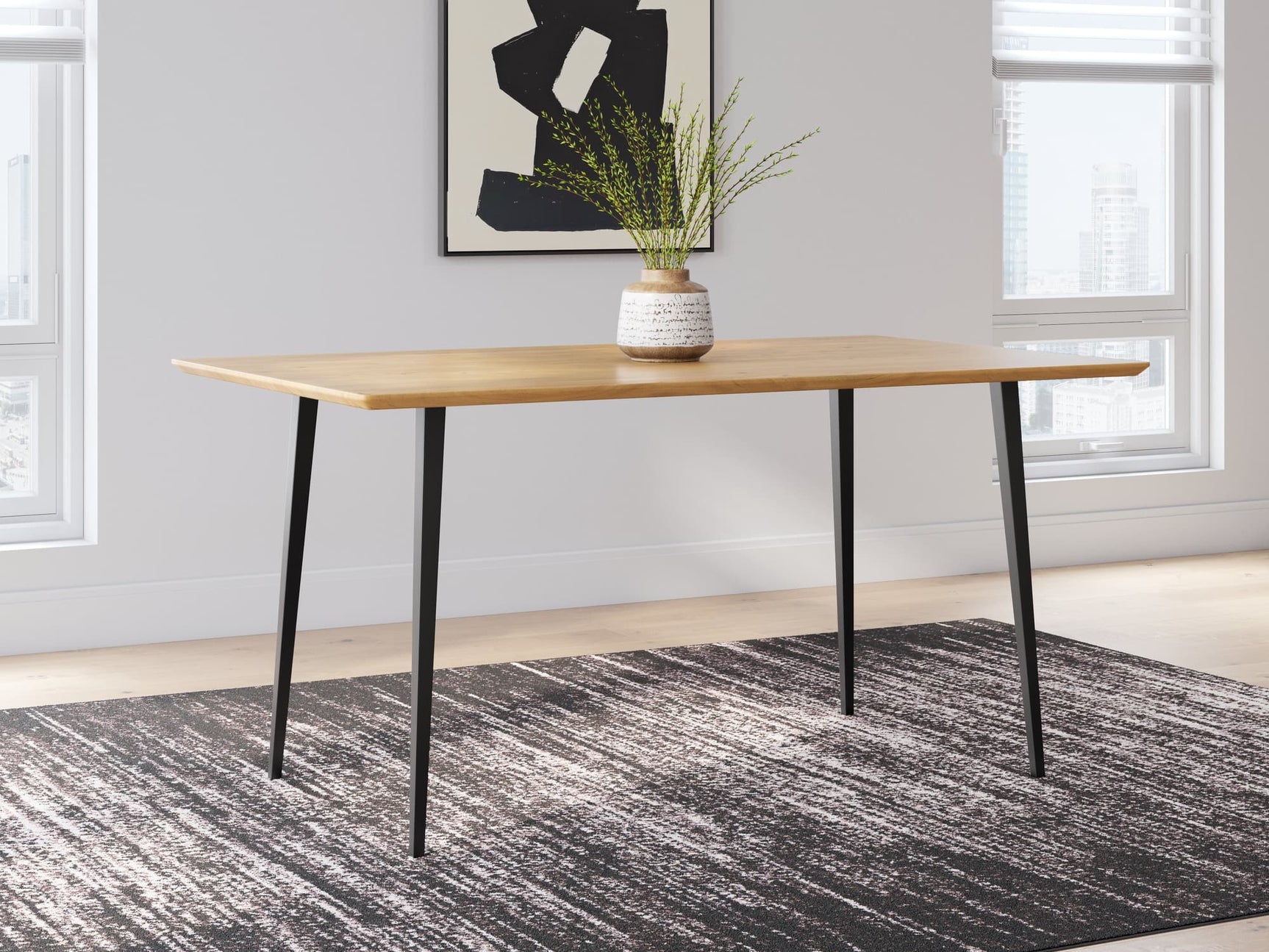Gretlynn dining table with light acacia wood top and black metal legs, front view