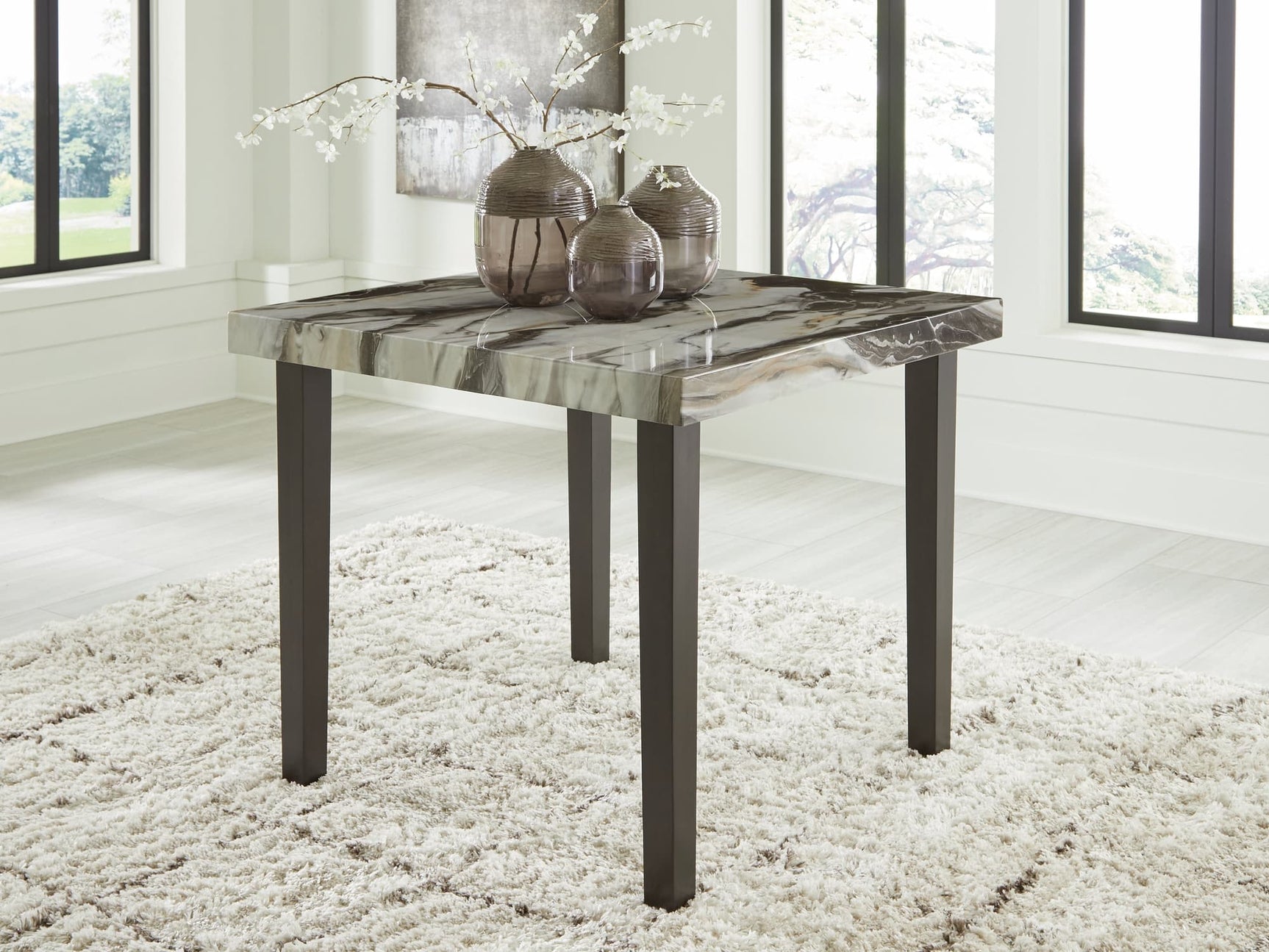 Jeshina dining table angled view showing faux marble top and tapered legs