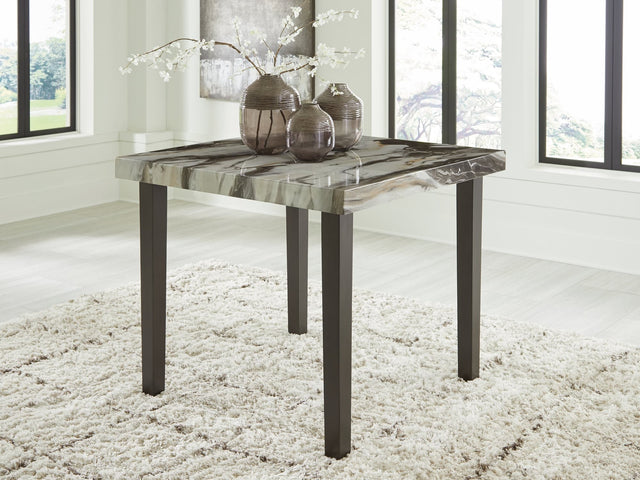 Jeshina dining table angled view showing faux marble top and tapered legs