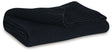 Gayelery black cotton throw folded on couch arm
