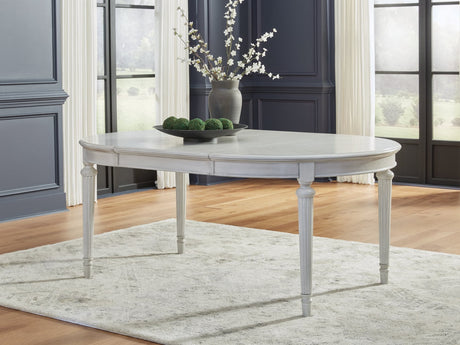 Montelaine Antique White Dining Extension Table, angled view with leaf
