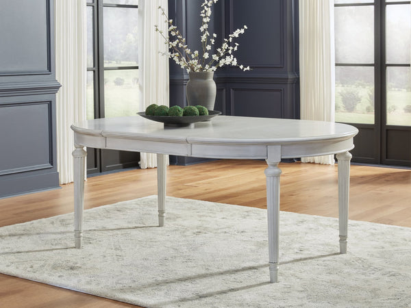 Montelaine Antique White Dining Extension Table, angled view with leaf