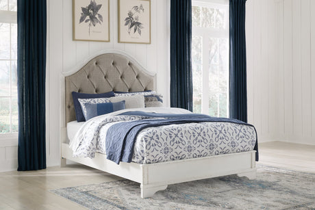 Blendon Rustic Brown Queen Upholstered Panel Bed angled side view