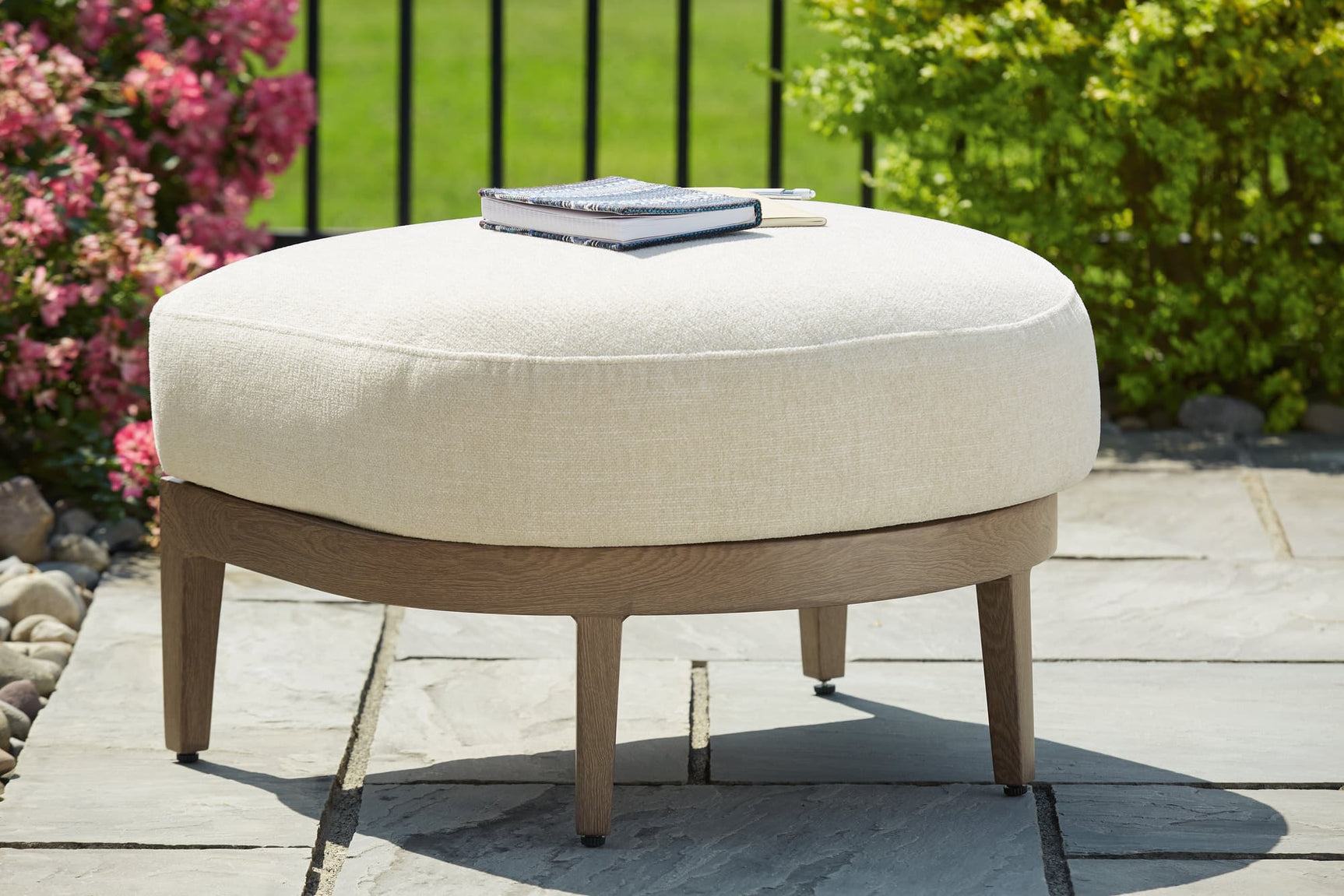 Serene Bay outdoor ottoman angled view with cushion