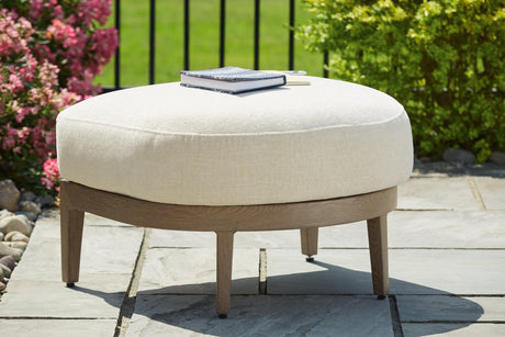 Serene Bay outdoor ottoman angled view with cushion