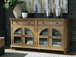 Barlomore Light Brown Accent Cabinet front view with arched glass doors