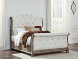 Ardenfield Light Brown Queen Upholstered Sleigh Bed front view with headboard and footboard