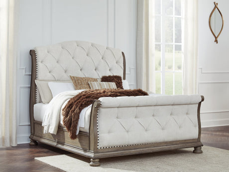 Ardenfield Light Brown Queen Upholstered Sleigh Bed front view with headboard and footboard