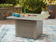 Cliff Trails Beige square fire pit table showing lit burner and glass beads