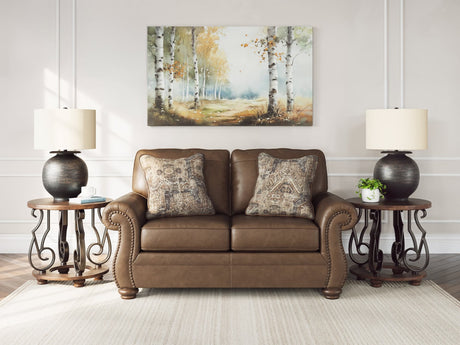 Chasemore Earth Faux Leather Loveseat front view with rolled arms and nailhead trim