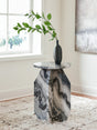 Wrenlane round marble accent table showing top and sculptural base