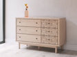 Arloster Tan Dresser front angle showing botanical drawer pattern