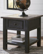 Tyler Creek rectangular end table with weathered grayish brown top and black textured finish, front view