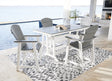 Transville gray and white outdoor counter height dining table with four barstools viewed from front angle