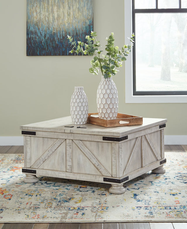 Carynhurst whitewash coffee table with dual-lid tabletop and hidden storage