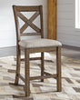 Moriville grayish brown counter height dining table and six barstools front angle