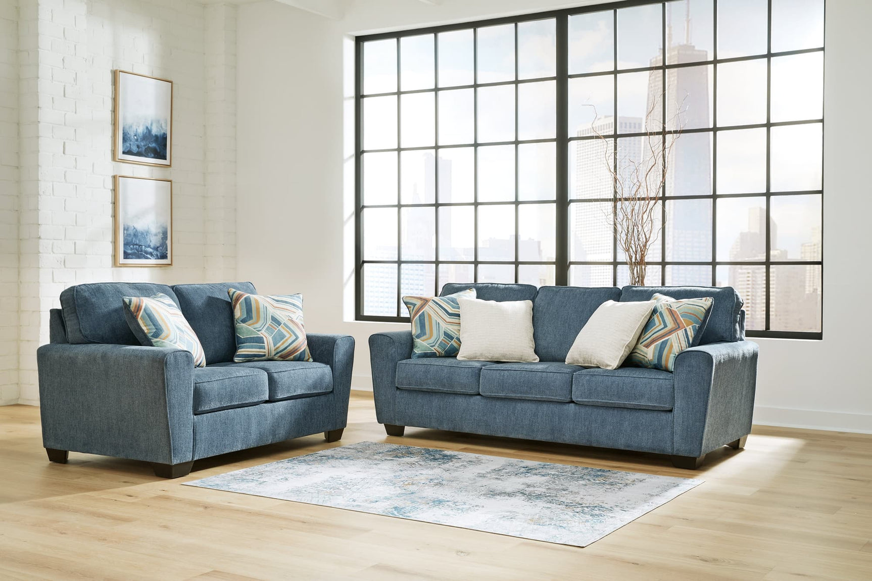 Blue Cashton sofa and loveseat set, front view