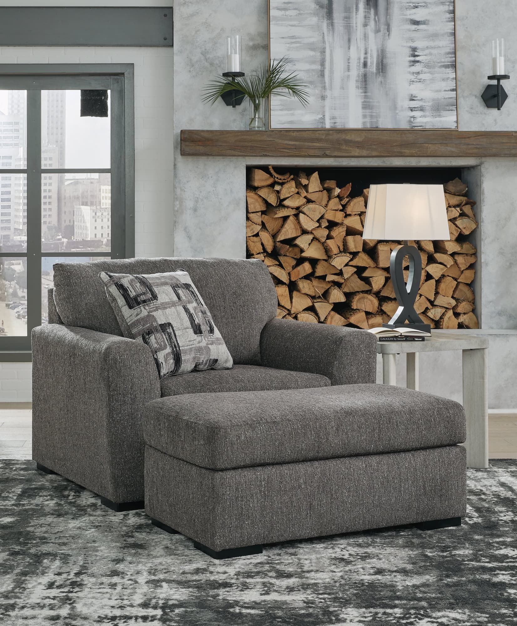 Gardiner pewter chair and ottoman front angle