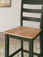 Gesthaven dining set showing natural wood table with green accents and two matching barstools