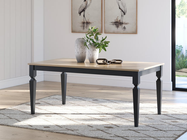 Brenkerton grayish brown and black mango wood dining table front view
