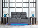Studio Cave power reclining loveseat side angle showing console and arm storage