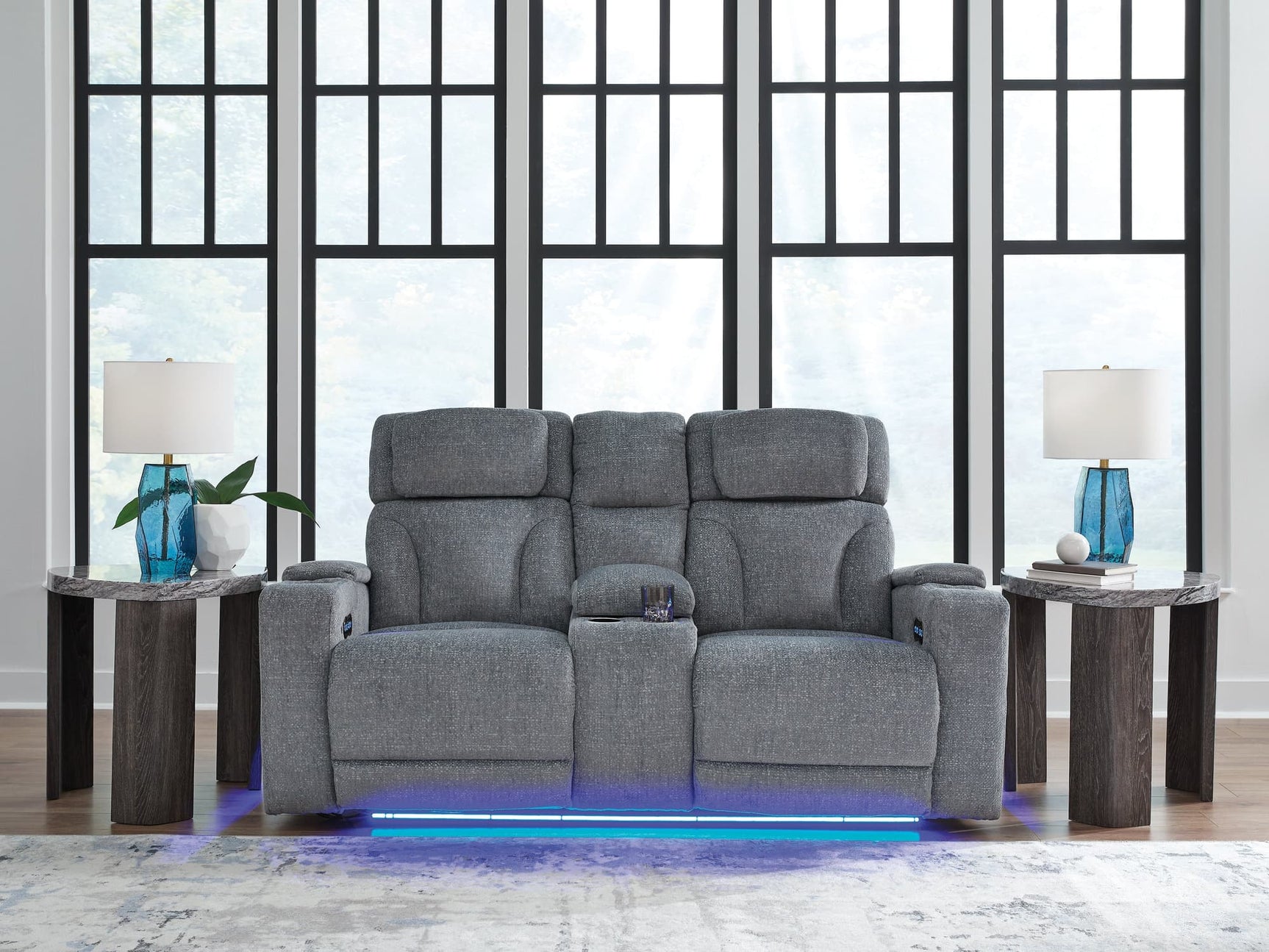 Studio Cave power reclining loveseat side angle showing console and arm storage