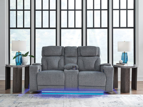 Studio Cave power reclining loveseat side angle showing console and arm storage