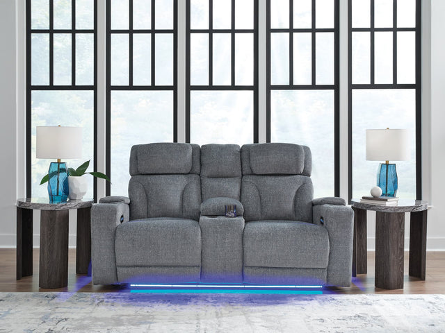 Studio Cave power reclining loveseat side angle showing console and arm storage