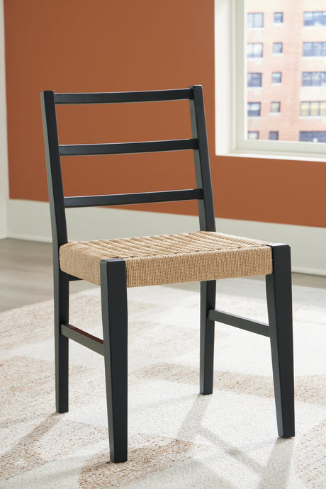 Isanti dining chair angled view showing light brown rattan seat and black wood frame