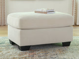 Greenbriar Ivory velvet ottoman angled view