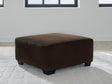Kimlee oversized chocolate velvet accent ottoman angled view