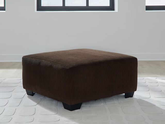 Kimlee oversized chocolate velvet accent ottoman angled view