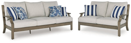 Front view of Rainier Ranch outdoor sofa and loveseat set in brown and beige