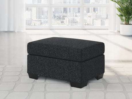 Jasmine Peaks Ottoman in coal chenille fabric, front angle