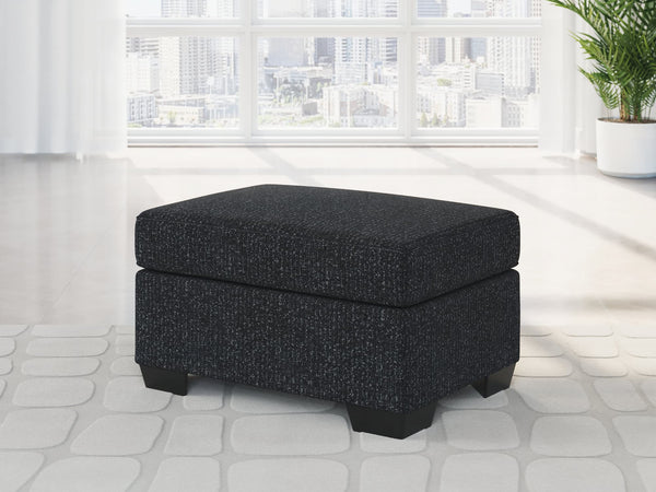 Jasmine Peaks Ottoman in coal chenille fabric, front angle