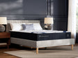 DreamCloud Classic Hybrid Queen Mattress in white fabric angled view