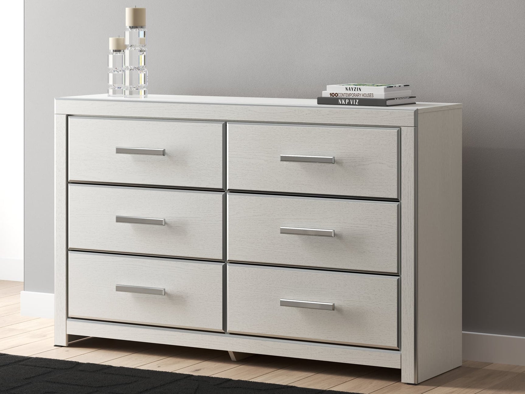 Zuraleus white dresser, front angle showing chrome-tone faceted drawer handles