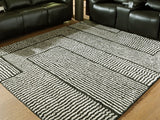 Kurtmen black and ivory 7'10 x 9'10 area rug flat view